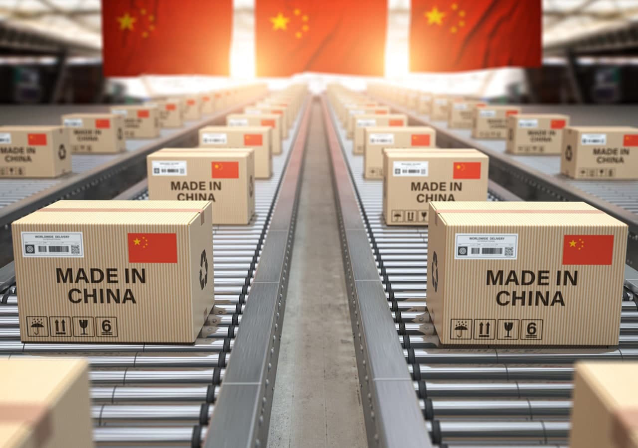 Boxes labelled Made in China moving along a factory conveyor